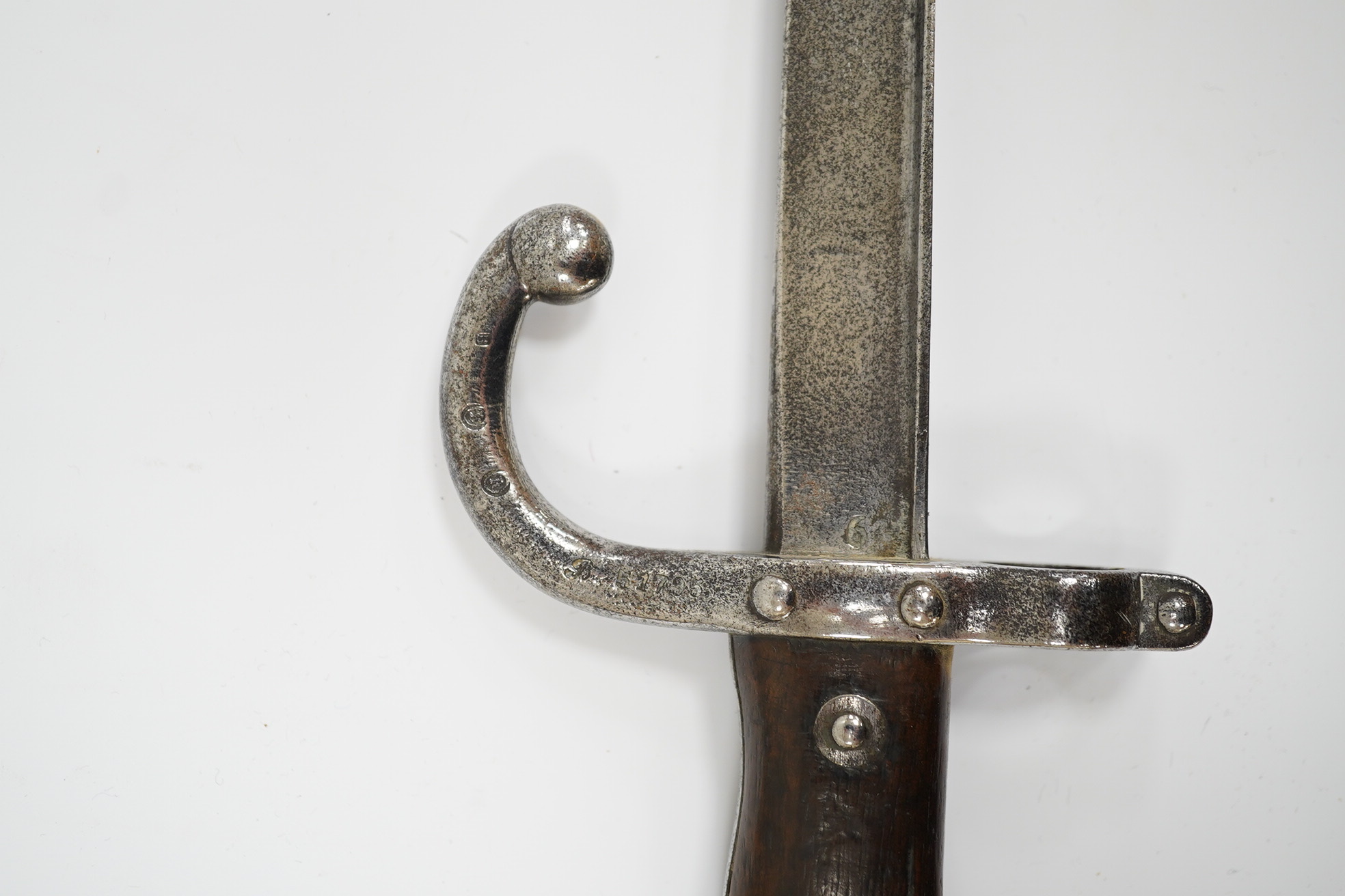 Two French Gras bayonets; a bayonet with a T-section blade dated 1877, and another almost identical blade dated 1879, scabbards missing. Condition - good